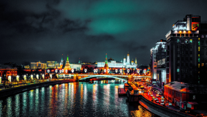 Night time view of a Moscow canal - the lights emitted from the buildings reflecting off the water